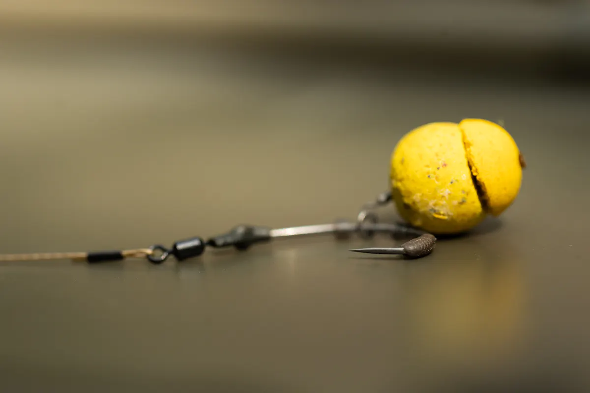 Tom's version of the shot-on-the-hook rig involves using a piece of rig putty moulded around the bend of the hook