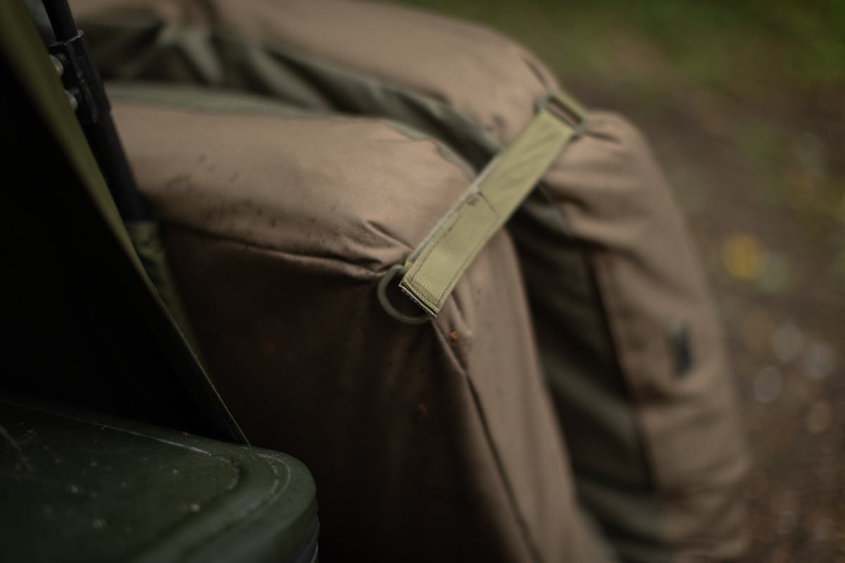 Four corner pegging rings can be secured to the ground plus there's a pocket for a dedicated Korda Carp Care Kit