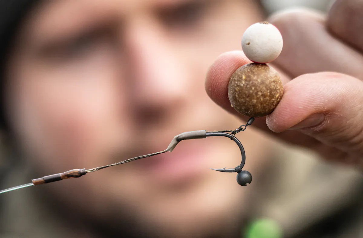 A shot on the hook works with bottom baits and wafters, but doesn't work with pop-ups and make the hook sit at a funny angle