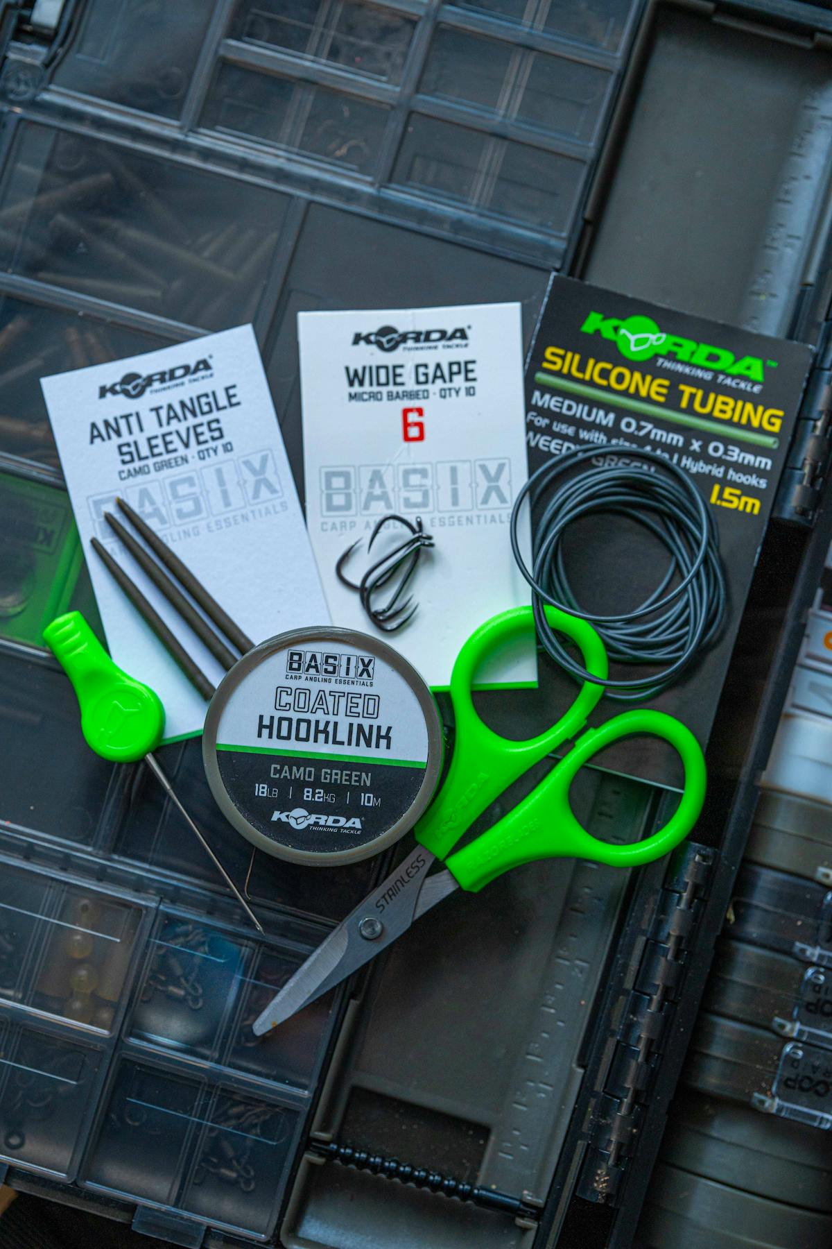 The Korda Basix Tackle Box is great for storing all your rig bits, and the lid features space for enough components in snap top compartments