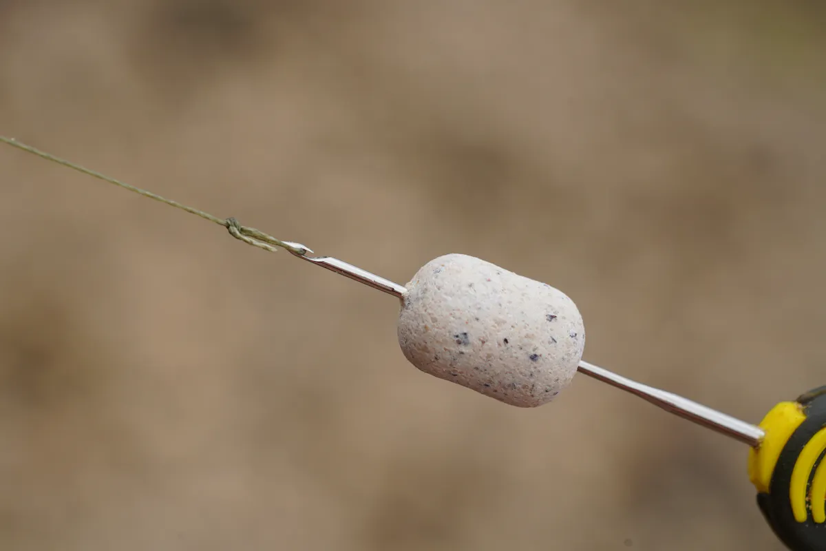 The KD Rig works with any balanced bait, including plastic corn, as long as it sinks slowly and the hook sits on the deck