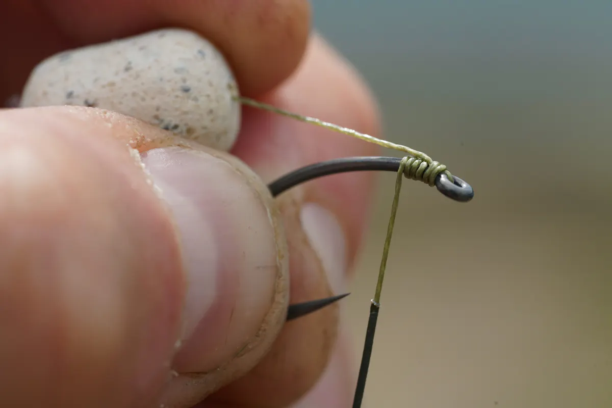 The KD Rig uses an adapted knotless knot, where the hair exits much further up the shank of the hook, near the eye