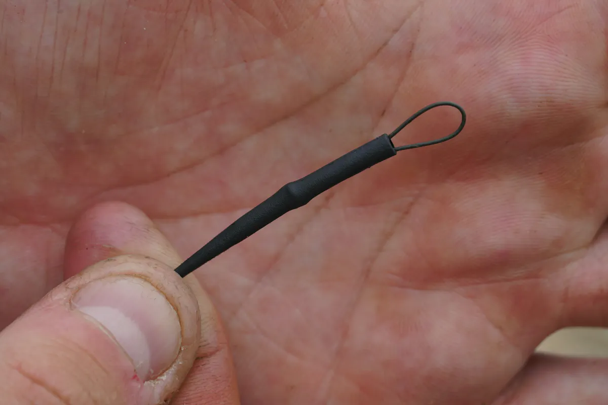 Tie a figure-of-8 loop knot in the other end of your hook link and add a Dark Matter anti tangle sleeve - this can easily be attached to any Korda QC swivel.