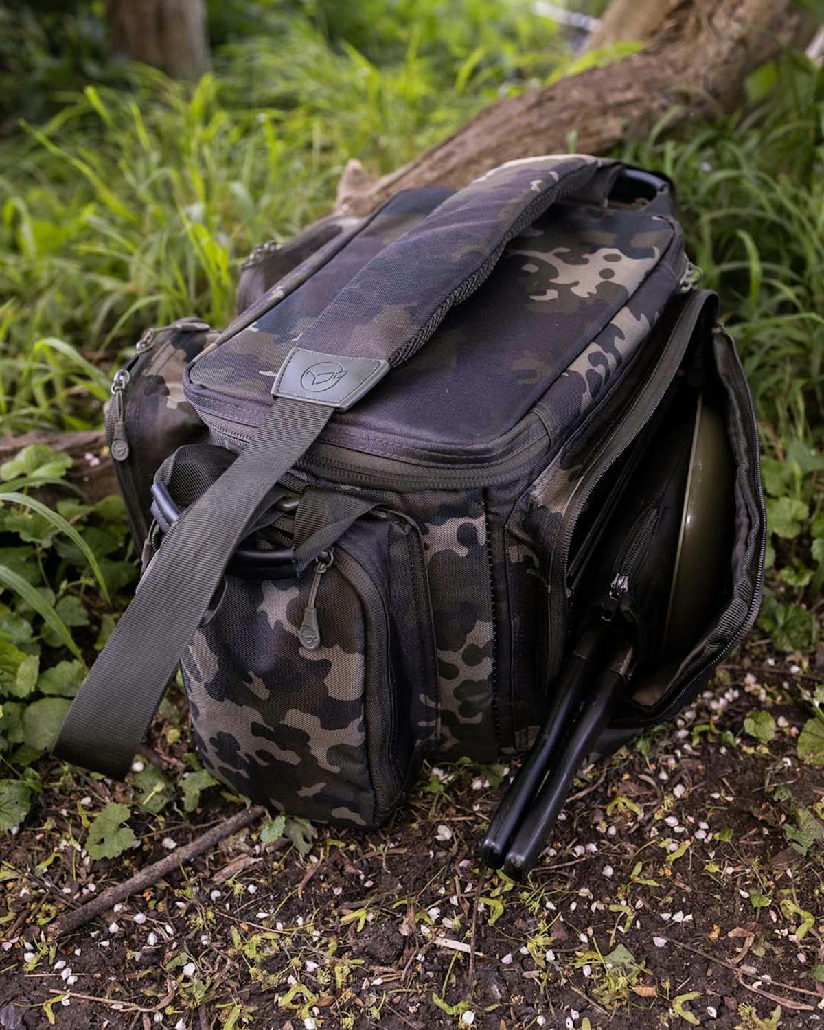 Dark Kamo Compac Carryalls are water resistant and designed so the inside stays dry, with a large main compartment and rigid lid.