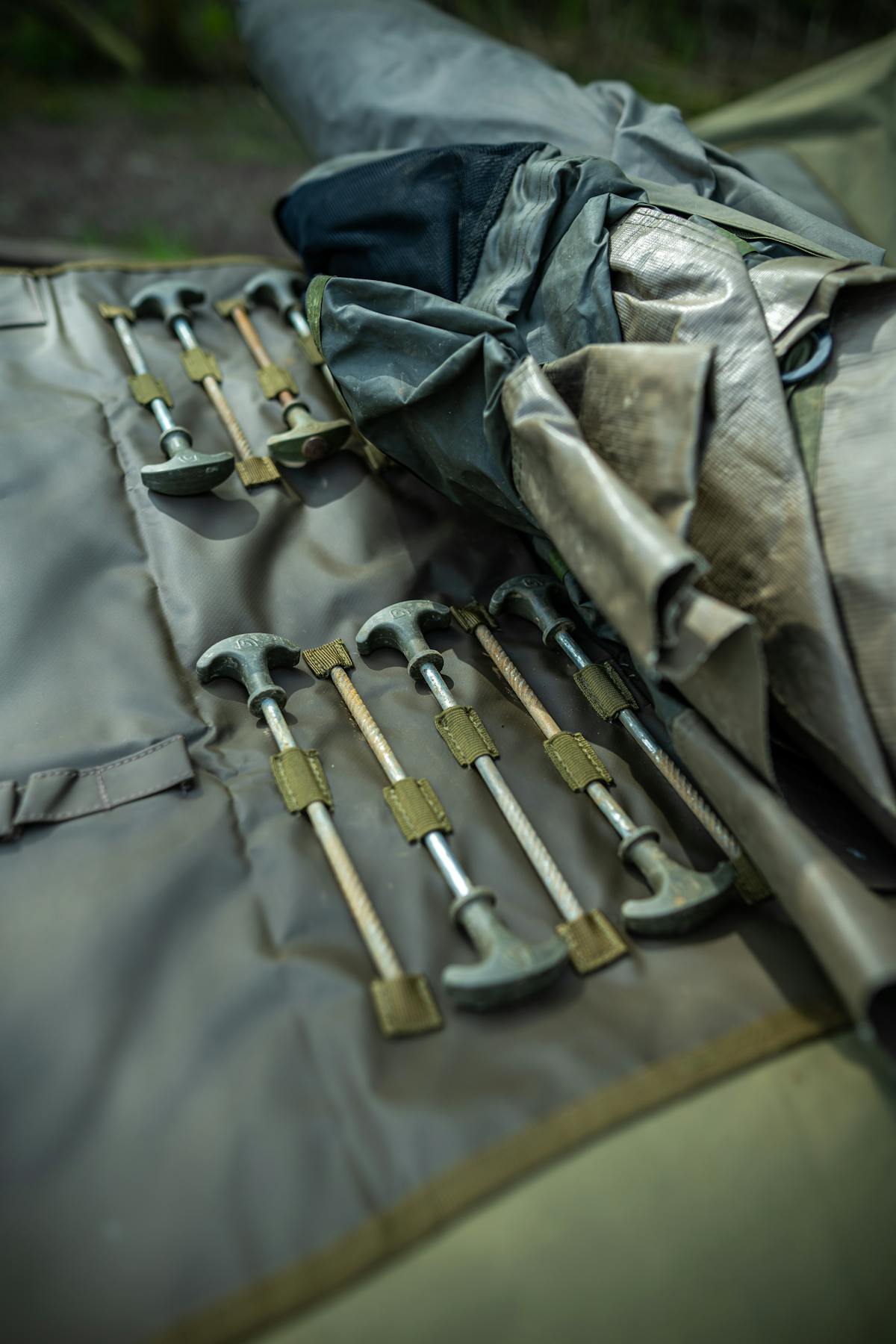 Peg retaining loops integrated into the Compac Bivvy Wrap enables you to keep those, plus your storm rods in the compartments provided, close to hand for when you need them