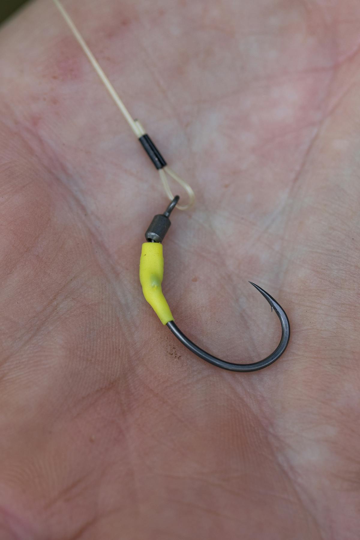 Push the kicker over the spinner swivel to secure the hook in place