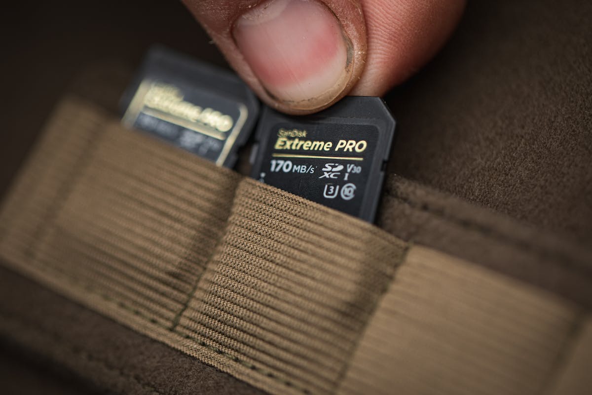 The Korda Compac Camera Bag features slots for storing memory cards