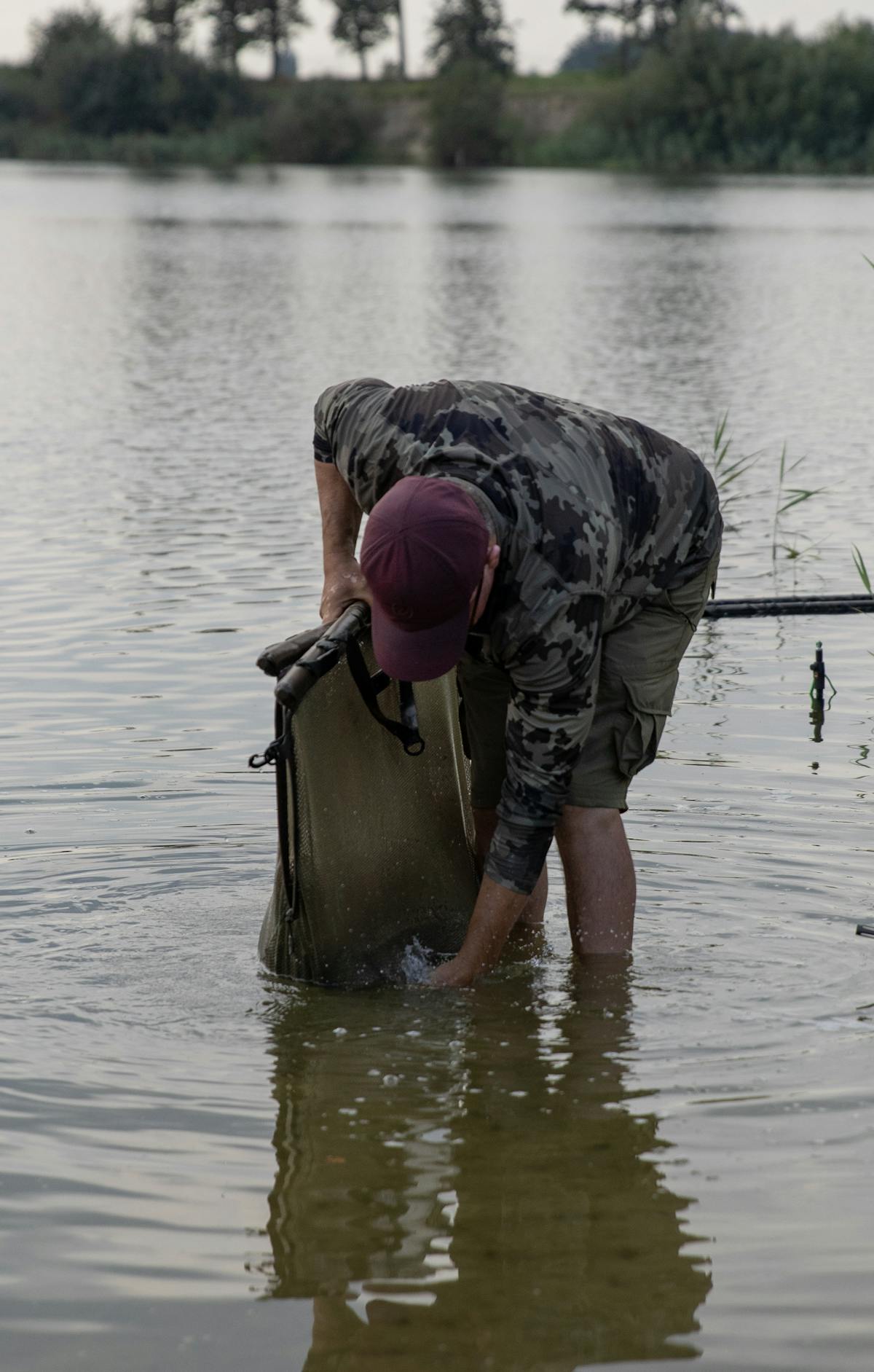 Once you've transferred the fish and landing net into your sling, make sure all the fins are laying flat against the body