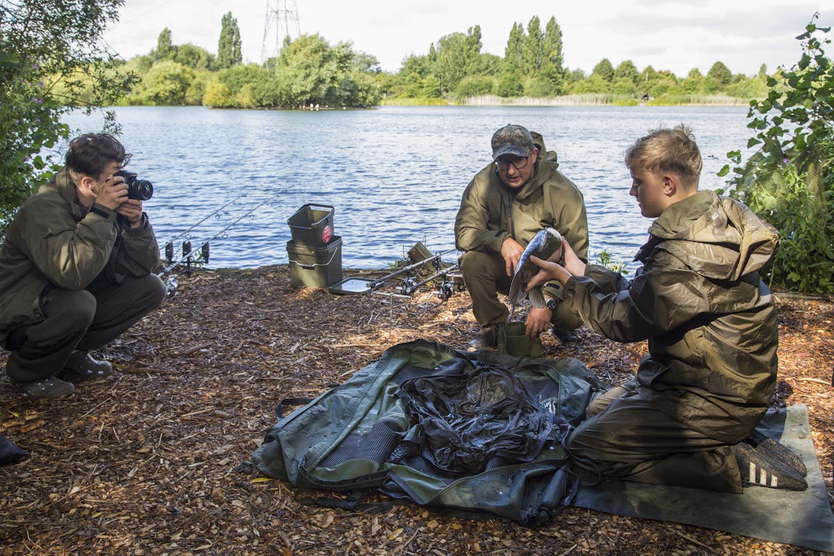 Danny Fairbrass teaching a couple of youngsters some of the photographic techniques that he uses