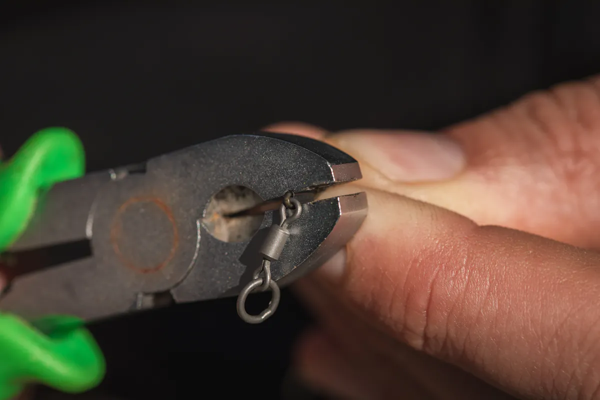 Use a Korda Krimp Tool to secure the crimp on your hinge stiff rig boom section - you can attach it to a normal swivel if using a lead clip rather than fishing it helicopter style