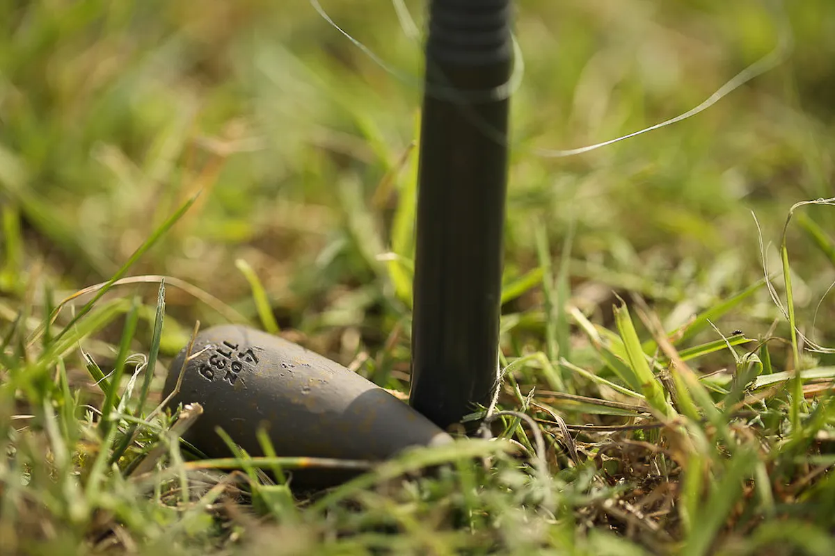 Place your lead at the base of your distance sticks and ensure that it can't move whilst you're wrapping your rod up