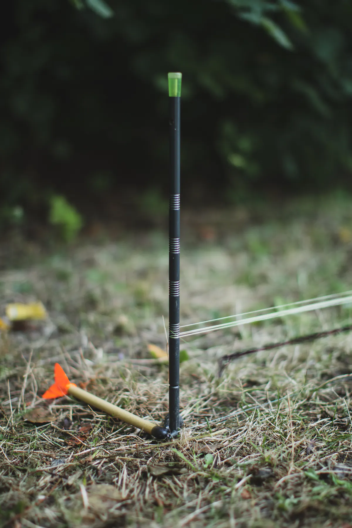 Lay your rig or marker float against the base of one of the sticks and then start measuring out your line, counting the wraps as you go