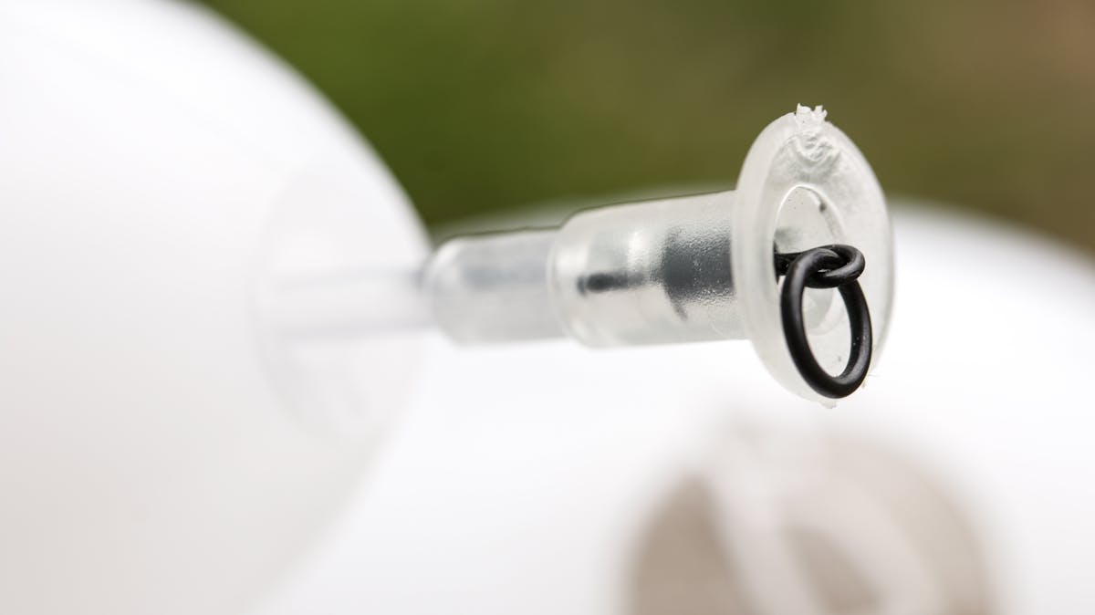 The Korda Interceptor has a soft rubber insert into which a QC, ring swivel, or standard swivel, tied to your main line, can be pulled to create a semi-fixed bolt effect