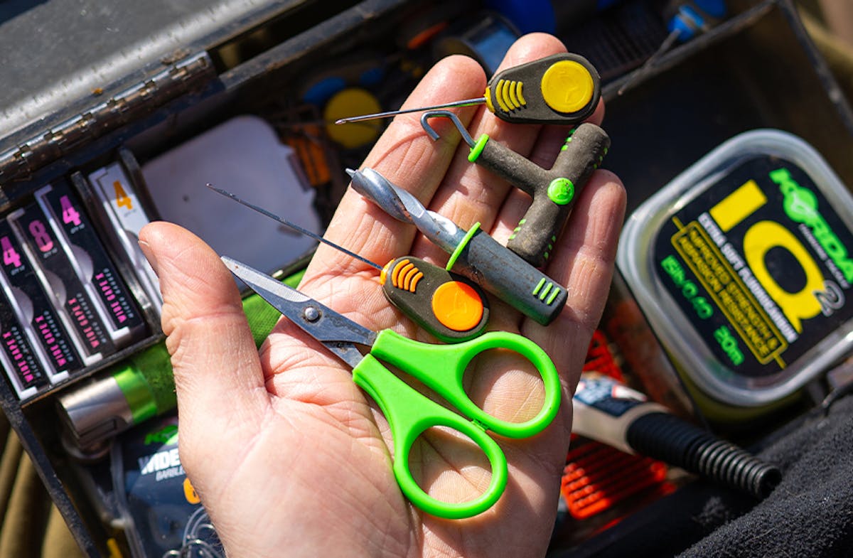 There are multiple variants of fishing tools such as baiting needles, scissors, and drills, and carrying a selection gives you the benefit of easily being able to construct any rig and attach any type of hook bait
