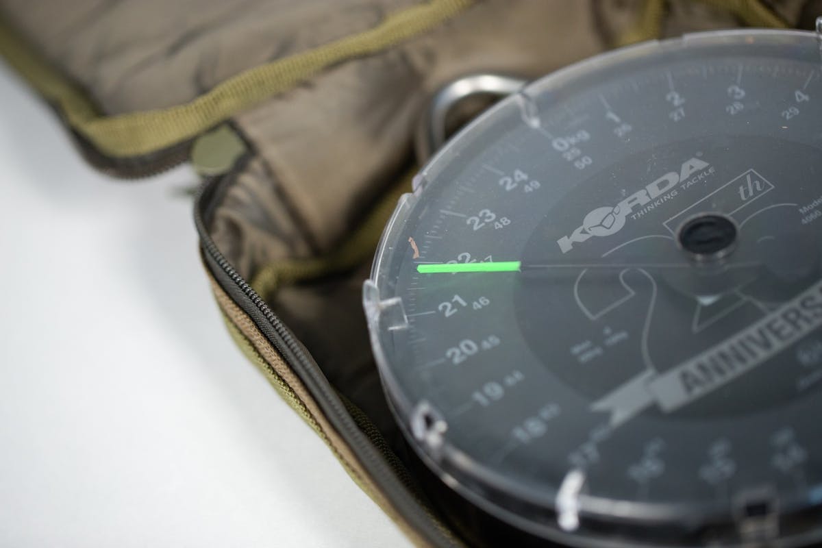 The Korda Compac Scales Pouch is durable and water resistant and any of the Korda dial scales or similar will fit inside