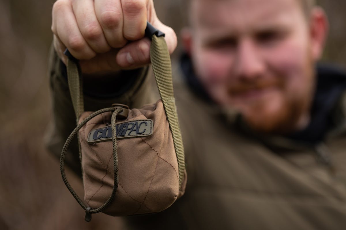 Reinforced webbing and a padded handle make it easy to get in and out of larger bags