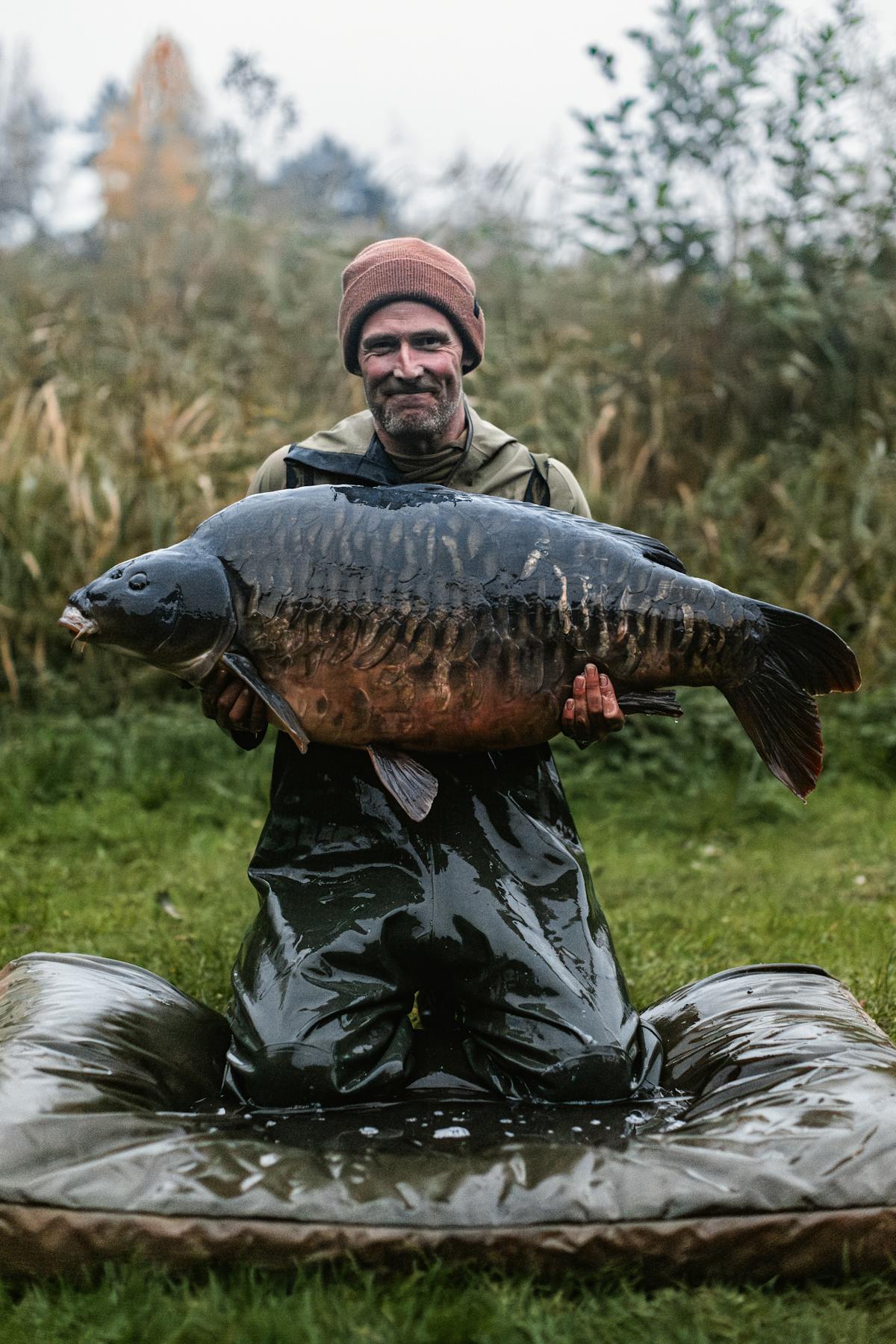 Photographers love to shoot during the 'golden hour' when the light is perfect, but with fishing that often isn't possible - this huge UK fully scaled was photographed at a high ISO as darkness started to set in, hence the image has some grain to it