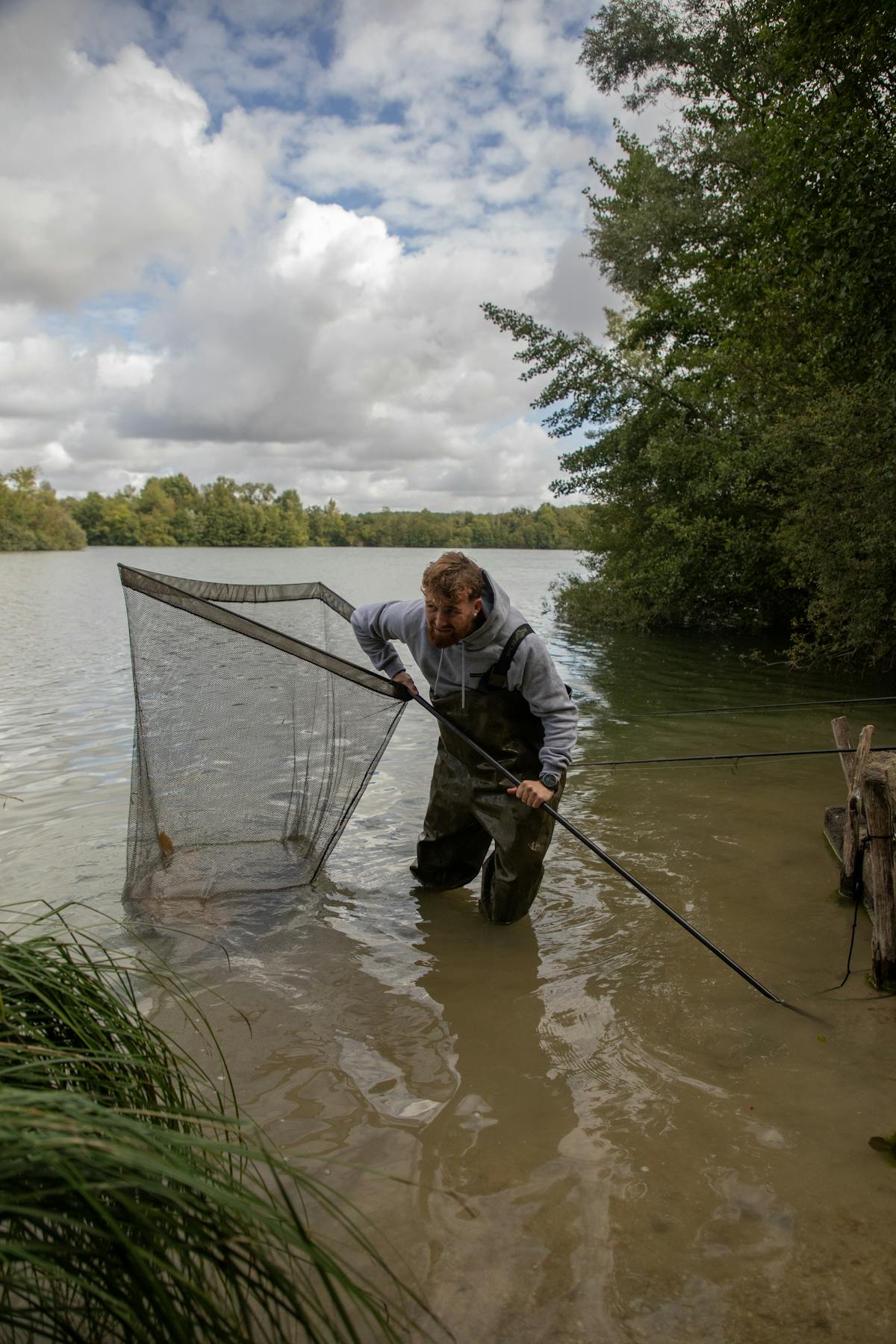 A strong handle with a stainless steel spike on the end can be pushed securely into most types of ground