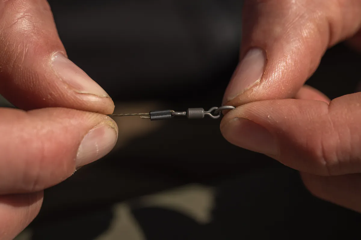 Crimping Hybrid is as strong as when it is tied properly, and a ring swivel is ideal for use with a helicopter lead arrangement