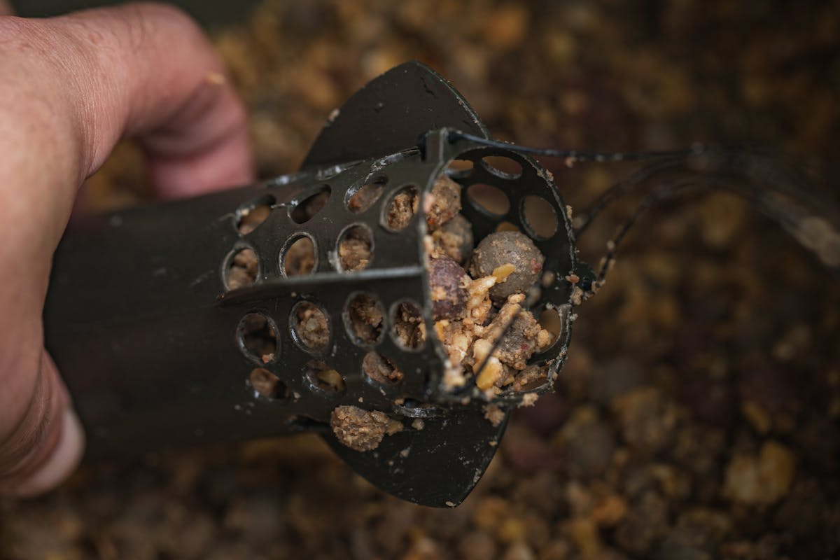 With a traditional spod some bait is lost out of the back of it during the cast and before the spod hits the water