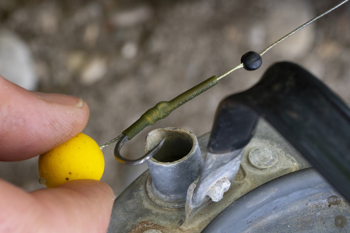 Hook shank extensions were traditionally created by steaming shrink tubing into the desired shape