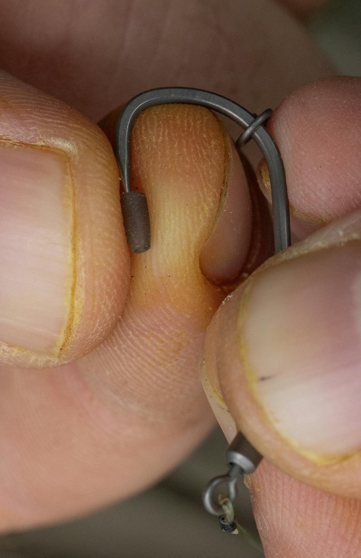 Push a hook bead over the point and move it round until it is opposite the barb