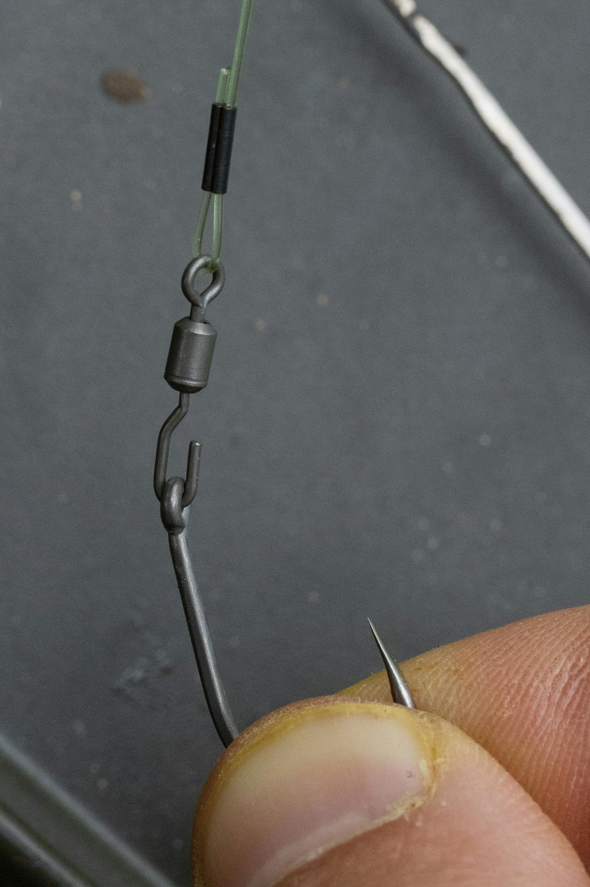 Thread your hook onto the spinner rig swivel, either from front to back or the other way around, it doesn't matter