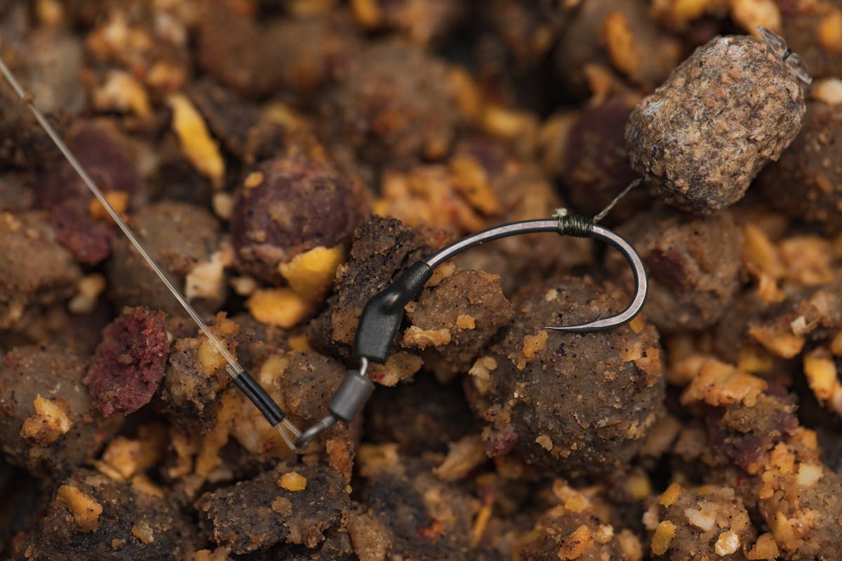 The exact method of attaching the bottom bait to the hook will vary depending on what type of rig the angler favours