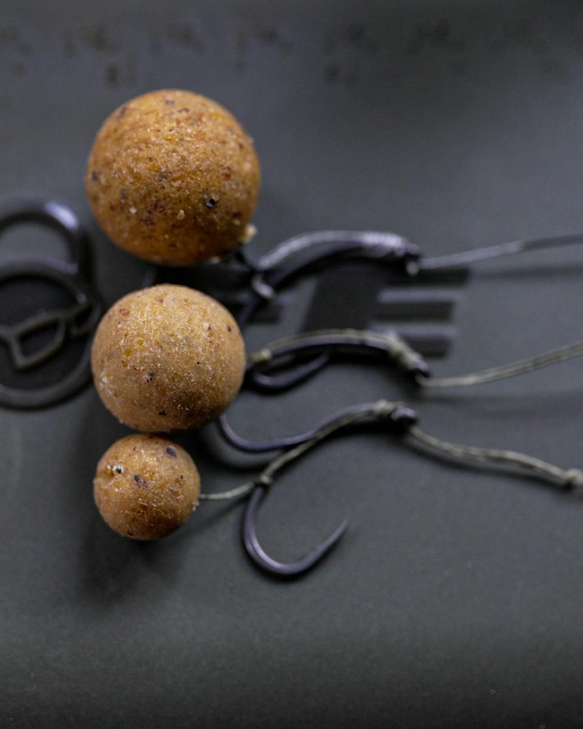 Depending on the size of the food items you are loosefeeding, you can choose an appropriate size of boilie as a hookbait